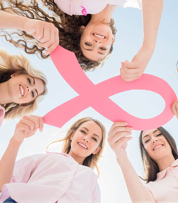 Hands joined in circle holding breast cancer struggle symbol 